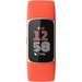 Fitness tracker watch with coral silicone band and black display, gold-toned frame
