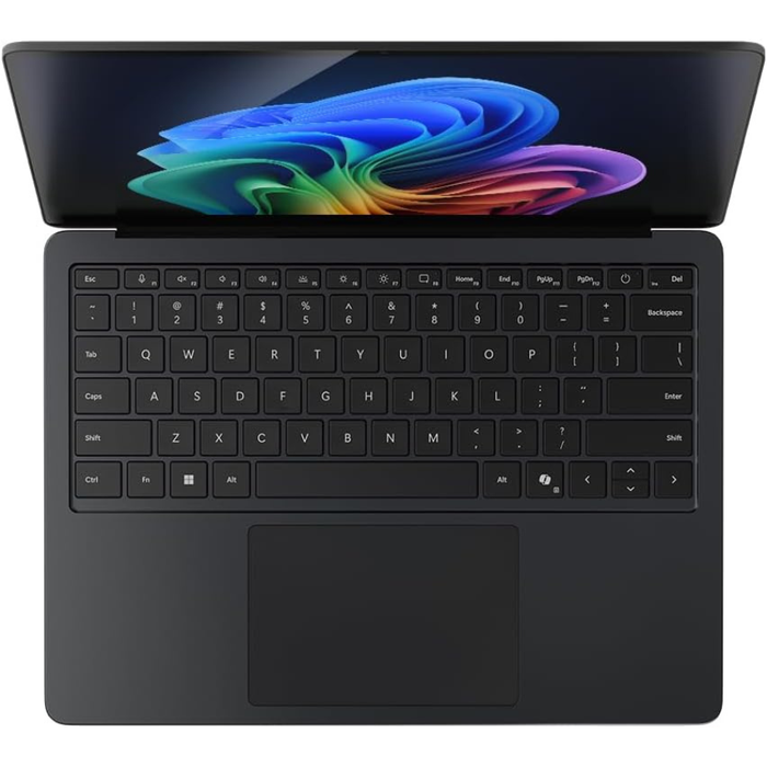 Black Microsoft Surface Laptop 13.8" open, showing keyboard and large trackpad.