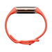 Fitness tracker watch with coral silicone band, side view showing gold-toned case